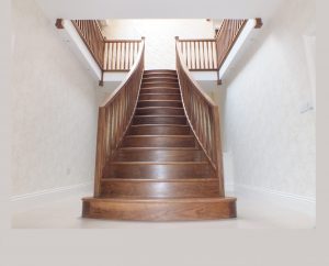 curved walnut staircase