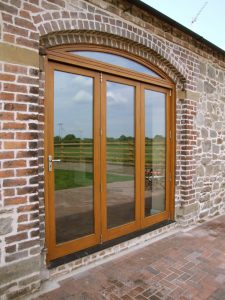 bi fold doors with curved head in barn