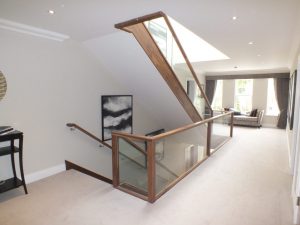 landing area, walnut and glass balustrade