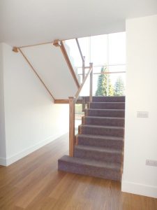 hardwood glass staircase with carpet