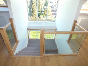 glass staircase with carpet