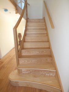 curved Ash staircase with glass