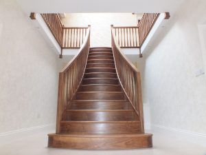 twin curved staircase, curved treads, modern spindles