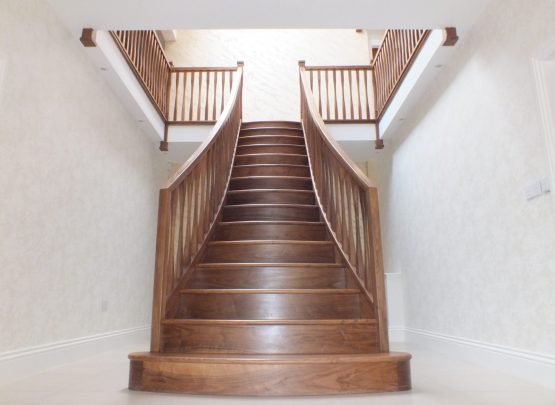 twin curved staircase, curved treads, modern spindles
