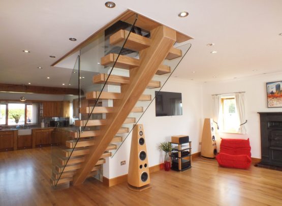 open plan, central spine staircase, free standing glass