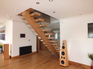 open plan, central spine staircase, free standing glass