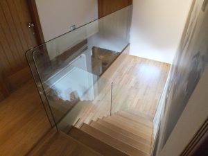 open plan, central spine staircase, free standing glass
