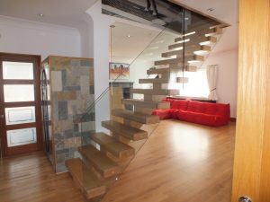 open plan, central spine staircase, free standing glass