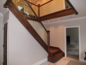 walnut staircase with glass, under stairs cupboard