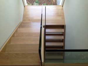 open plan staircase, free standing glass, cream tiles