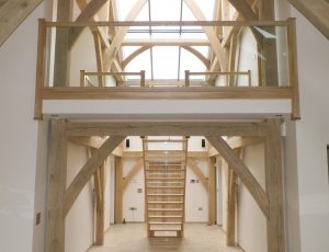 open plan glass staircase in barn conversion
